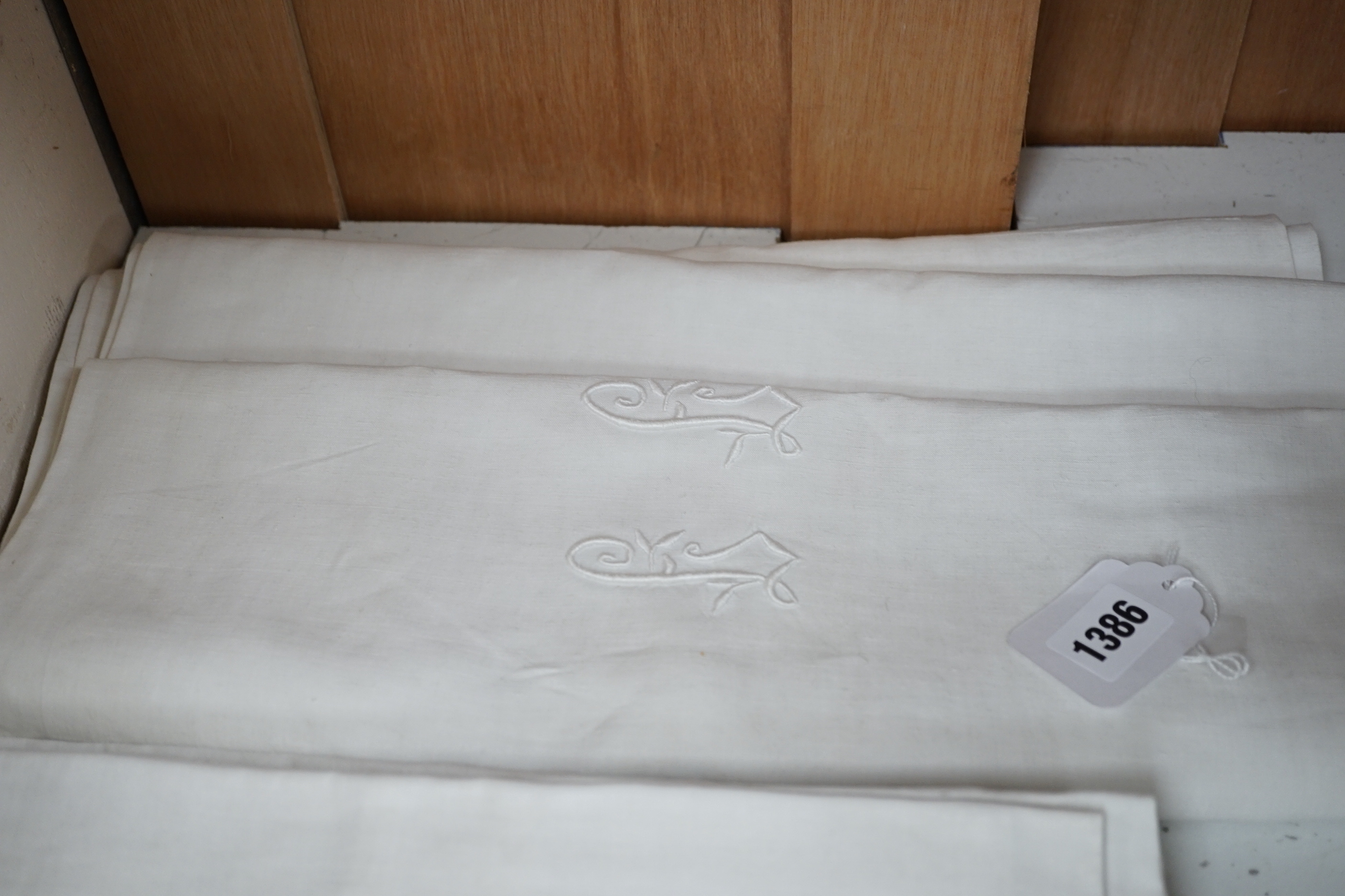 A French monogrammed linen refectory tablecloth and twelve matching dinner size napkins